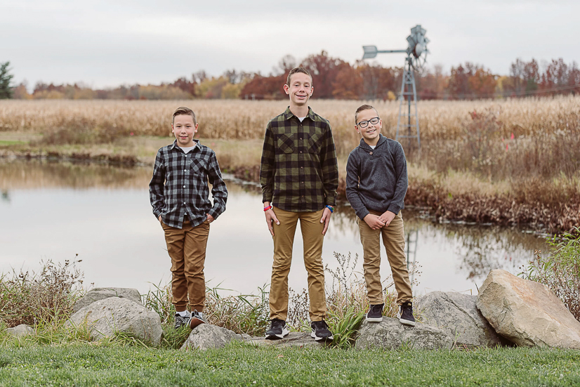 three sons standing by pond once upon a child ohio