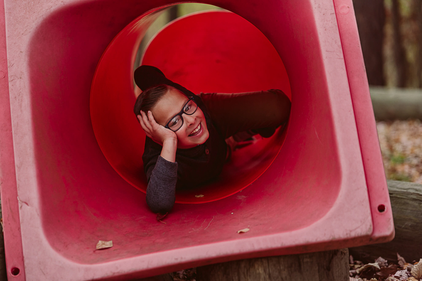 boy smiling in park slide once upon a child ohio