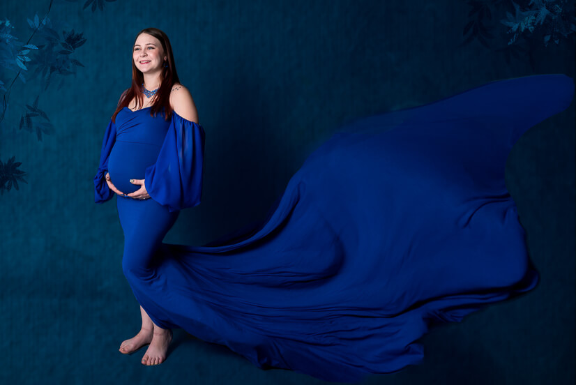 The Womb Wellness Center mother dressing blue for maternity sessions