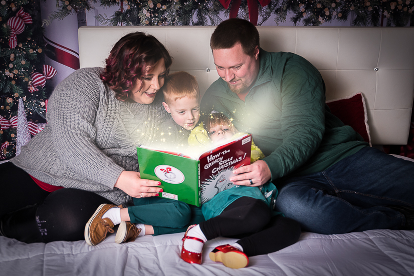 family reading book with glow for cleveland family photographer lego store beachwood