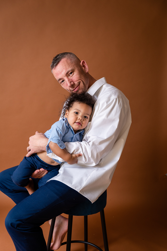 Father and son looking at camera during family session with Cleveland Family Photographer Things To Do In Youngstown Ohio For The Entire Family To Enjoy