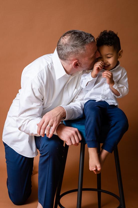 Father and son in a studio session with a brown backdrop Things To Do In Youngstown Ohio For The Entire Family To Enjoy