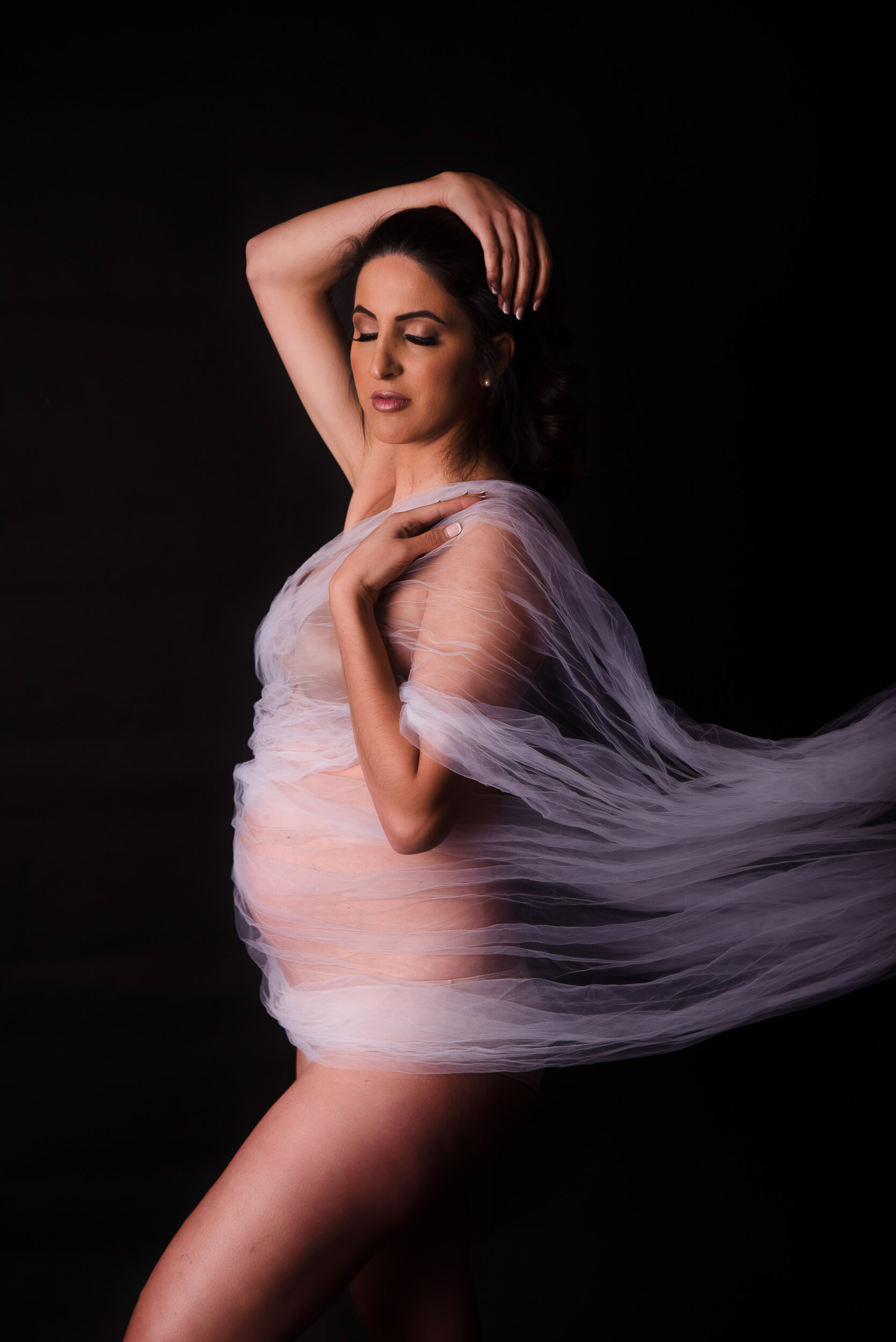 Mother in a tulle photography set for Cleveland Maternity session