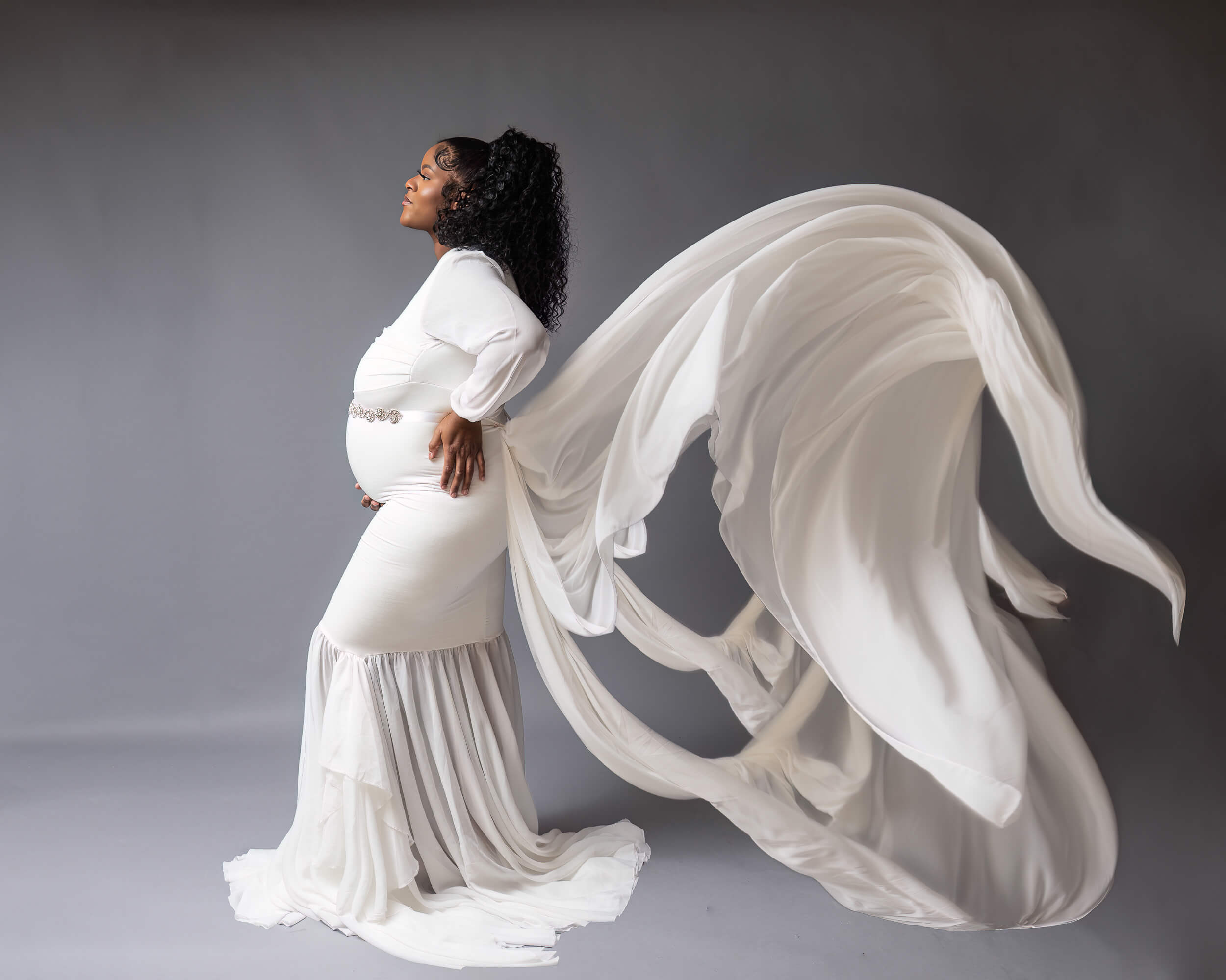 Mother in white dress with flying fabric with Cleveland Maternity Photographer