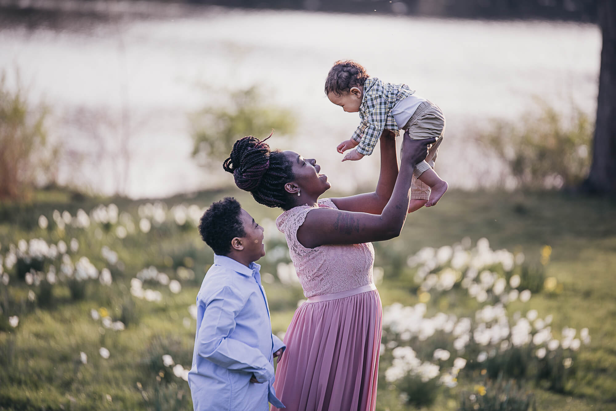 Mother and sons in a daffodil flower park for Rainbow Babies and Children’s Hospital