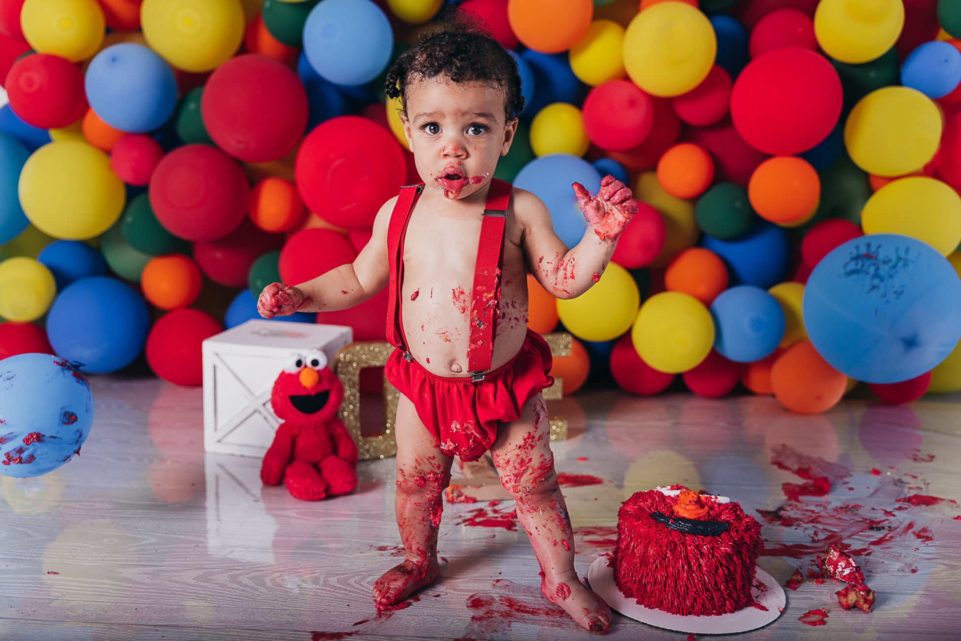 child with red elmo cake smash Things to do with kids in Cleveland Ohio