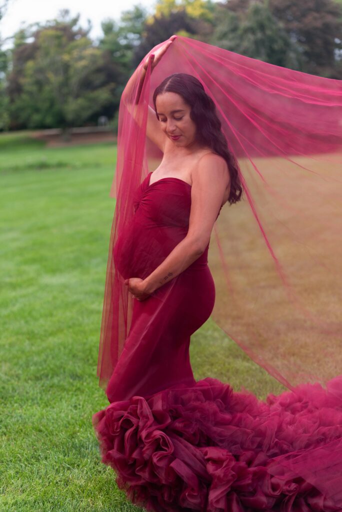 mother folding red fabric up maternity clothes cleveland ohio