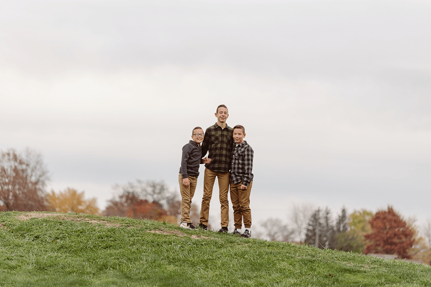 Brothers standing on hill looking at camera Chagrin Valley Little Theatre