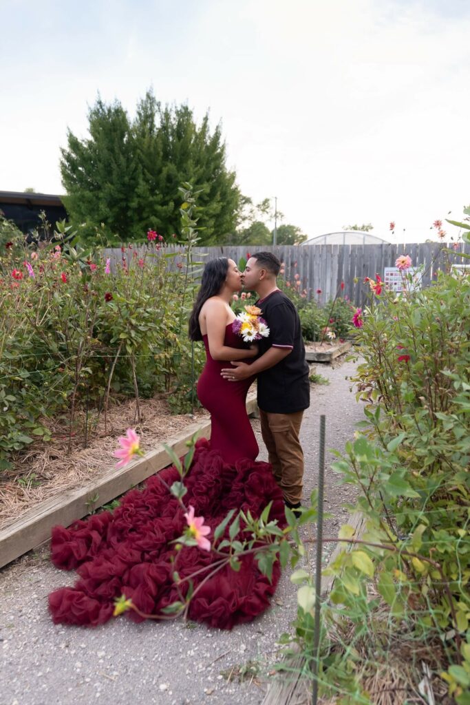 hushand and wife kissing in Mill Creek Fellowship Riverside Garden Cleveland Pregnancy Center