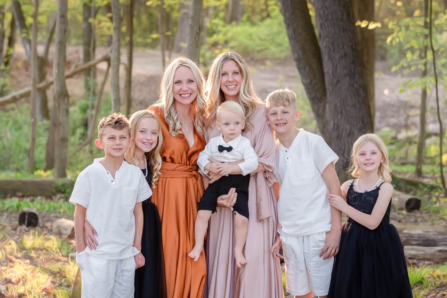 family dressed up standing together smiling at camera for Ohio's Center for Oral, Facial & Implant Surgery