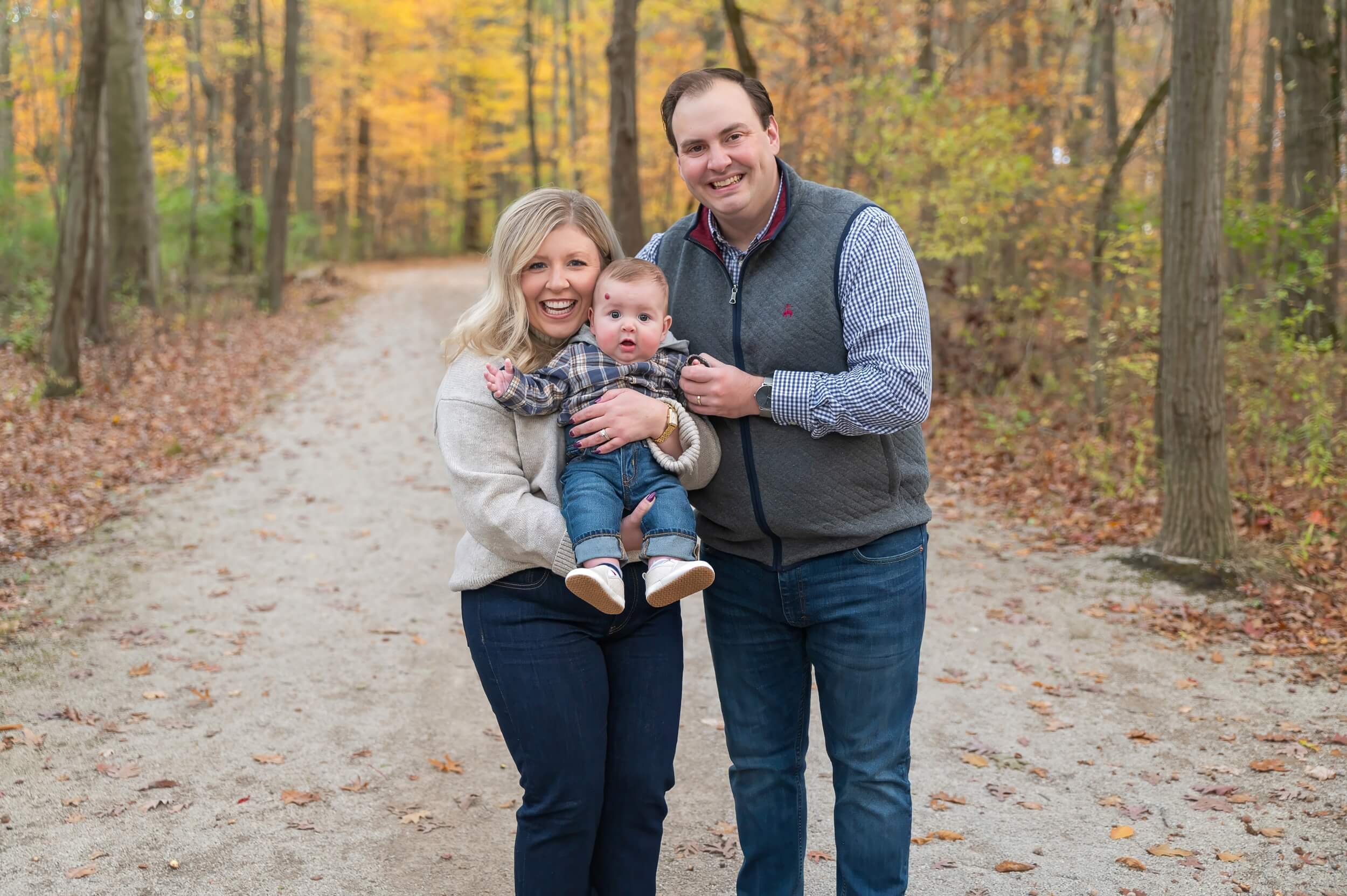Family wearing coordinated fall outfits for an outdoor family photography session in Northeast Ohio
